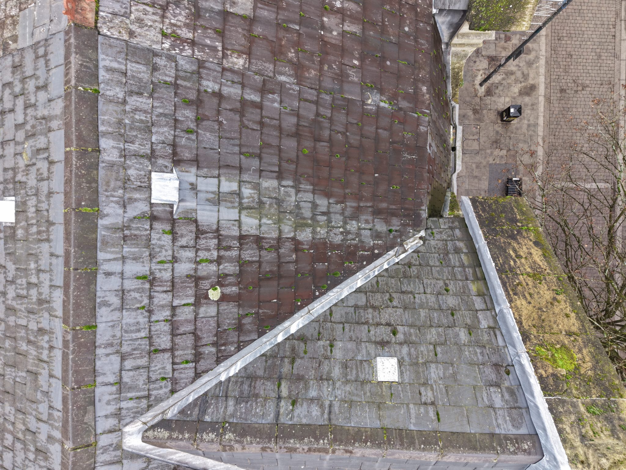 Aerial view of a commercial roof during an inspection in Newport