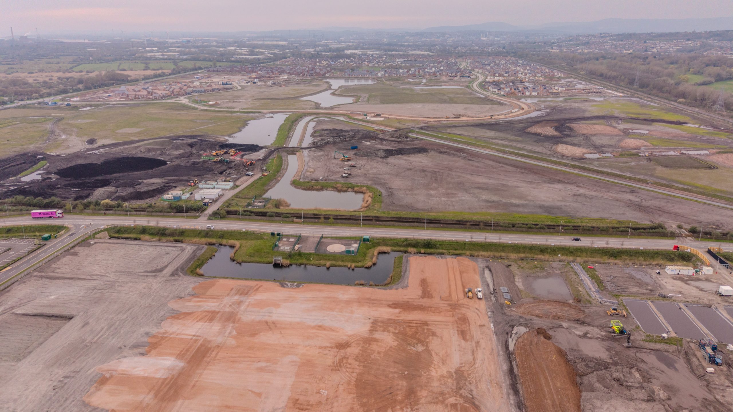 Wide aerial image showing large-scale development and infrastructure landscape in South Wales