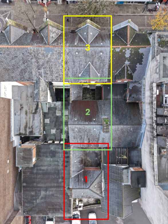 Annotated aerial roof overview showing separate inspection areas on commercial property